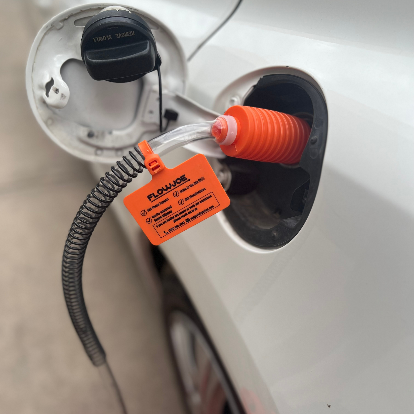 Handy pump manual fuel transfer pump shown getting gas out of a car 